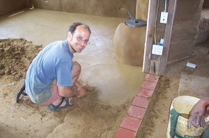 Tony Sirna, intern supervisor, installing an earthen floor Tony Sirna, intern supervisor, installing an earthen floor