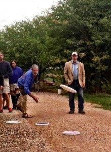Bob goes for par on the 9-hole "fris-lid" (that's an improvised bucket lid frisbee) golf course, set up for Dancing Rabbit's 2013 Land Day. Photo by Nik.