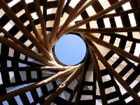 Reciprocal roof on a cob house. A great metaphor for community and consensus.