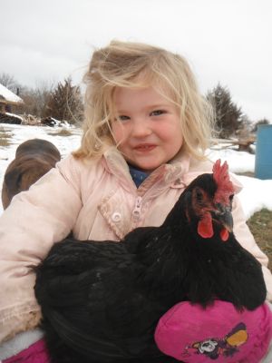 Althea and one of her many chicken friends.