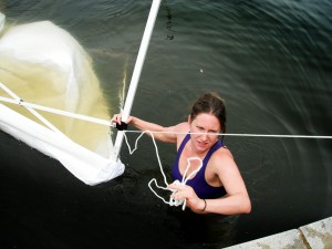 Julie jumped in to rescue the DR booth tent after it flew into the nearby lake. Photo by Josi.