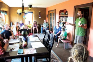 Bear entertains a tour with tales of natural building in his family's home, Lobelia. Photo by Zach.