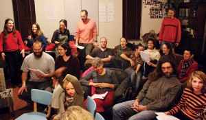 Happy folks at the holiday singalong; Meadoe hosted and accompanied on piano. Photo by Rae.
