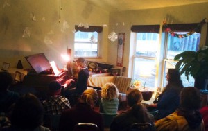 A "starring" rendition of the theme from Star Wars was a room-pleaser at the first ever Dancing Rabbit piano recital. Photo by Katherine.