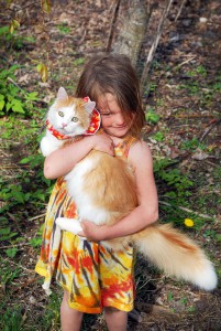 Althea holding Wallace. His spiffy new collar should make him more visible to birds, less likely to hunt them successfully. Photo by Katherine.