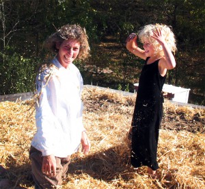 Sharon with Aurelia mulching the rooftop garden. Photo by Dennis.