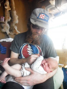 Papa Ben holding the newest little Critter, Arthur Osage Brownlow. Photo by Mae.