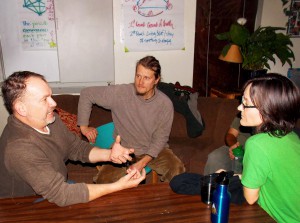 Trainer Tom (left) speaks passionately to Ted and Tereza about improving connection using "Matrix" methods during a Retreat break. Photo by Dennis.