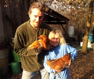 Ted and Aurelia show two clipped-wing chickens. Photo by Sara.