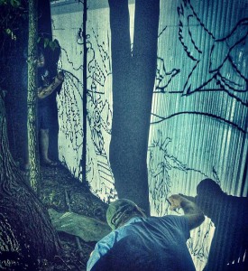 Artists Scout and Nik working on the new mural! Photo by Javi.